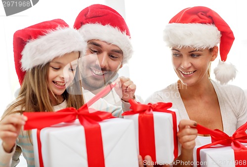 Image of happy family sitting on couch at home