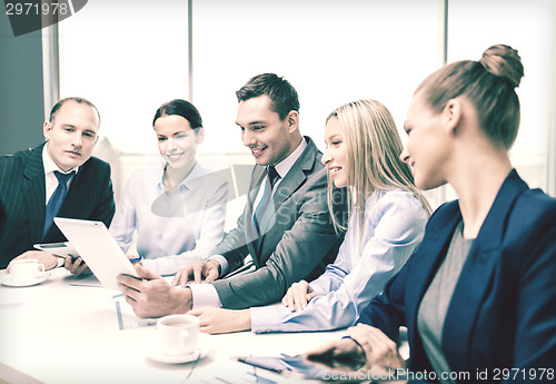 Image of business team with tablet pc having discussion