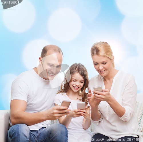 Image of happy family with smartphones