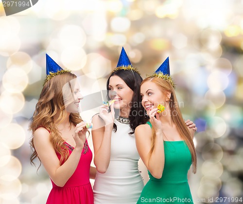 Image of smiling women holding glasses of sparkling wine