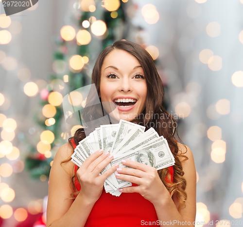 Image of woman in red dress with us dollar money