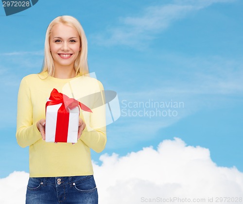 Image of smiling girl with gift box