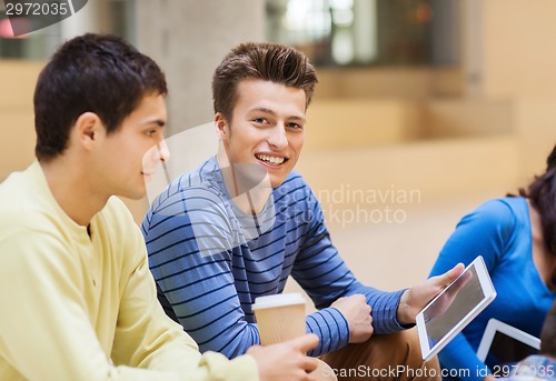 Image of group of students with tablet pc and coffee cup
