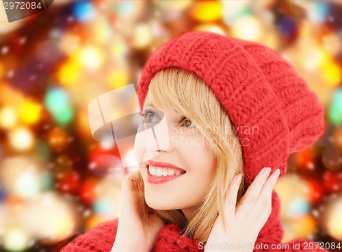 Image of smiling young woman in winter clothes