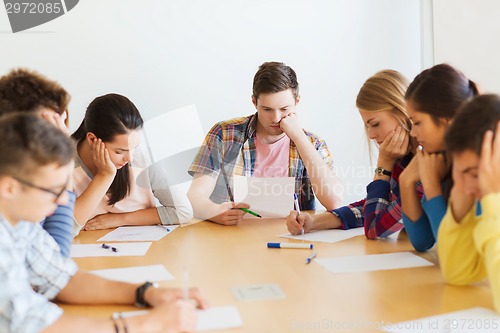 Image of group of students with papers