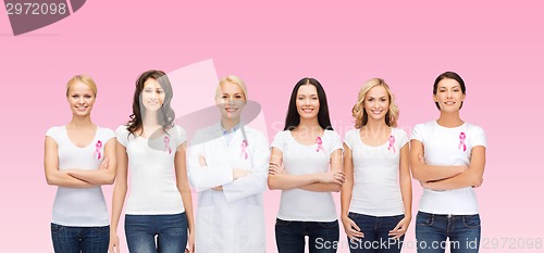 Image of smiling women with pink cancer awareness ribbons