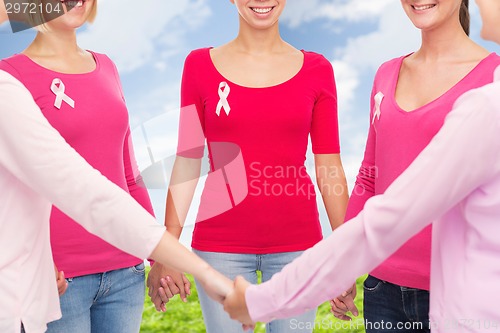 Image of close up of women with cancer awareness ribbons