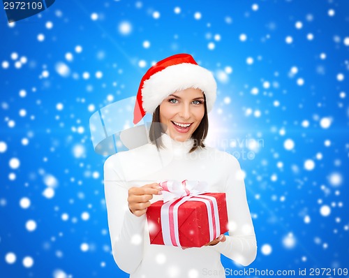 Image of smiling woman in santa helper hat with gift box