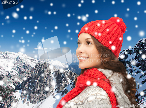 Image of smiling young woman in winter clothes