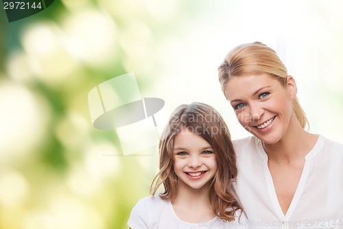 Image of smiling mother and little girl