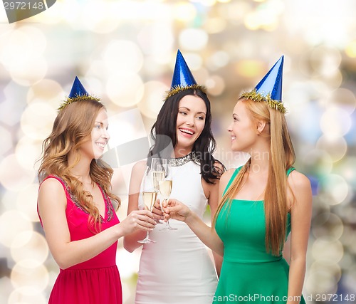 Image of smiling women holding glasses of sparkling wine