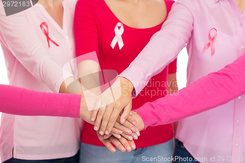 Image of close up of women with cancer awareness ribbons