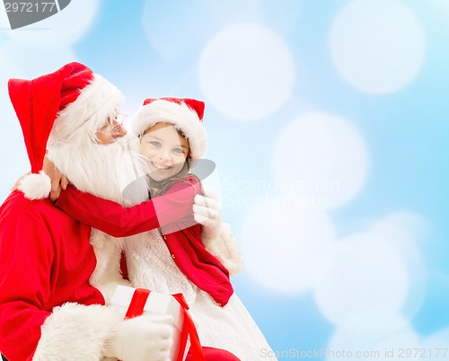 Image of smiling little girl with santa claus