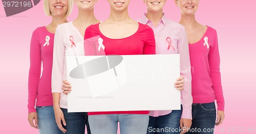 Image of close up of women with cancer awareness ribbons