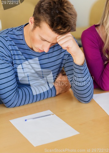 Image of group of students with papers