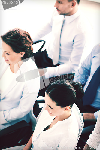 Image of businessmen and businesswomen on conference