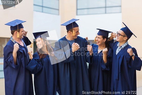 Image of group of smiling students in mortarboards