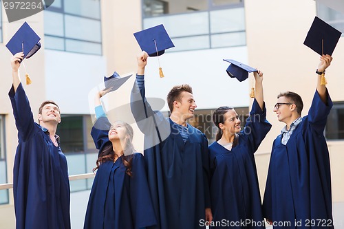 Image of group of smiling students in mortarboards