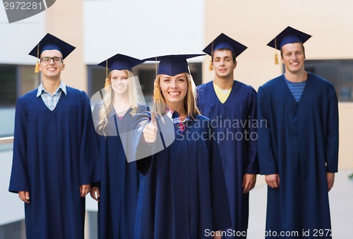 Image of group of smiling students in mortarboards