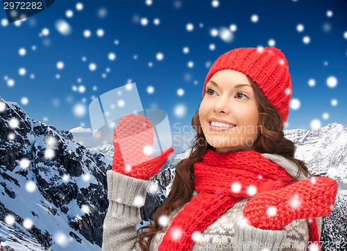 Image of smiling young woman in winter clothes