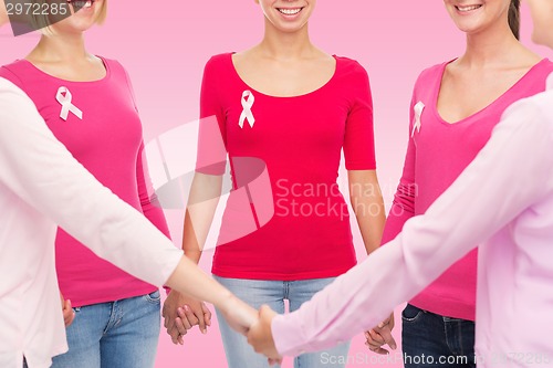 Image of close up of women with cancer awareness ribbons