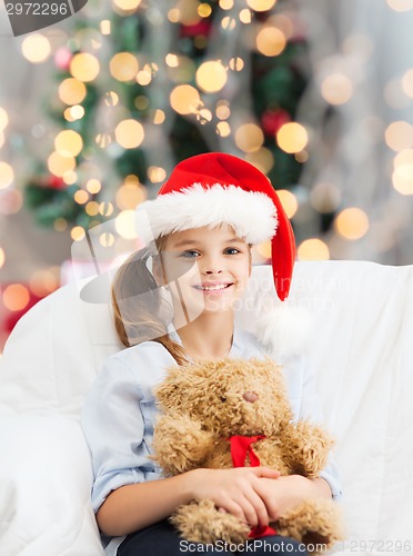 Image of smiling little girl with teddy bear