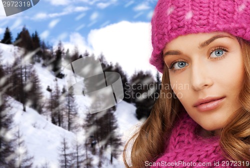 Image of close up of smiling young woman in winter clothes