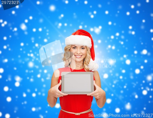 Image of woman in santa helper hat with tablet pc