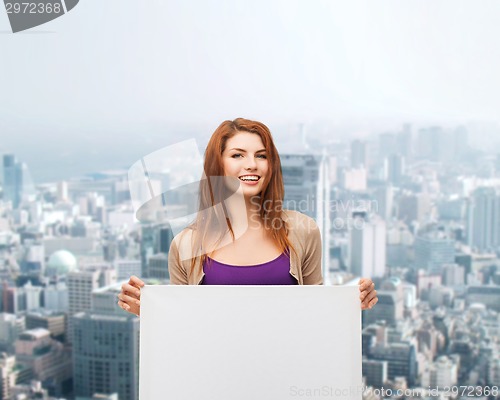 Image of smiling teenage girl with white board