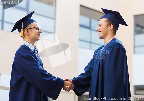 Image of smiling students in mortarboards