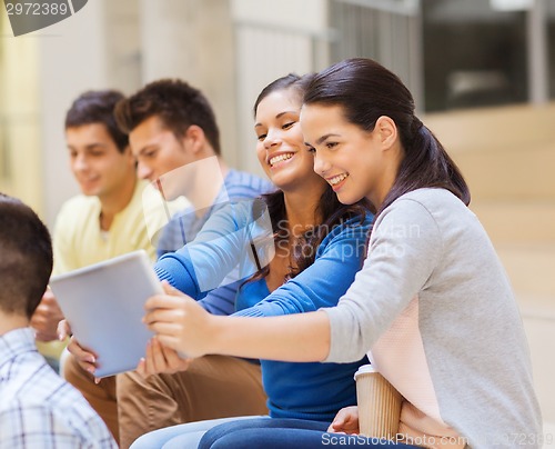 Image of group of smiling students with tablet pc
