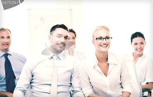 Image of businessmen and businesswomen on conference