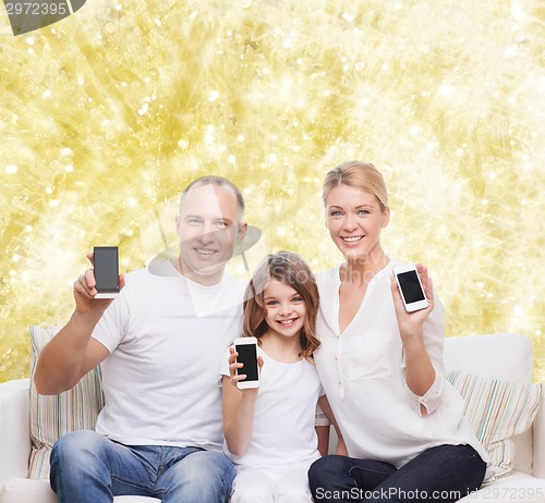 Image of happy family with smartphones