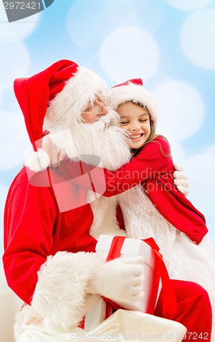 Image of smiling little girl with santa claus
