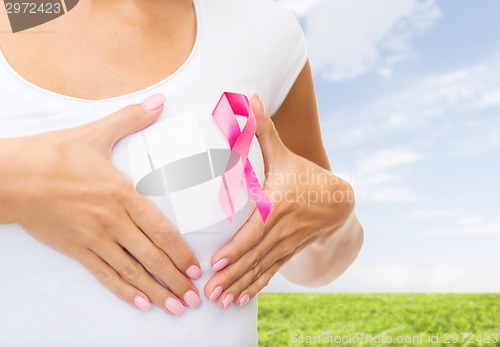 Image of close up of woman with cancer awareness ribbon