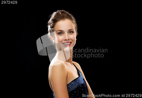 Image of smiling woman in evening dress