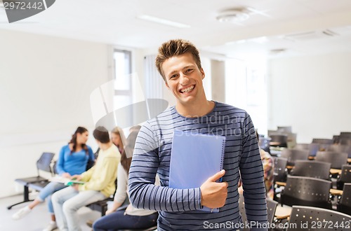 Image of group of smiling students in lecture hall