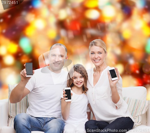 Image of happy family with smartphones