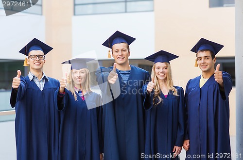 Image of group of smiling students in mortarboards