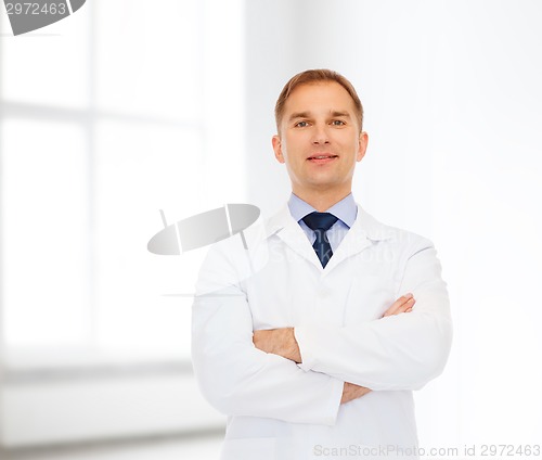 Image of smiling male doctor in white coat