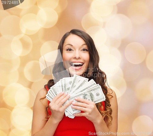 Image of woman in red dress with us dollar money