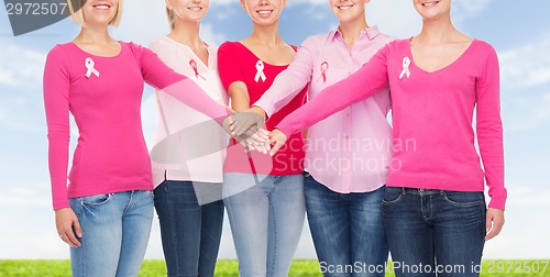 Image of close up of women with cancer awareness ribbons