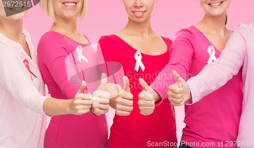 Image of close up of women with cancer awareness ribbons