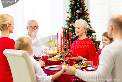 Image of smiling family having holiday dinner at home
