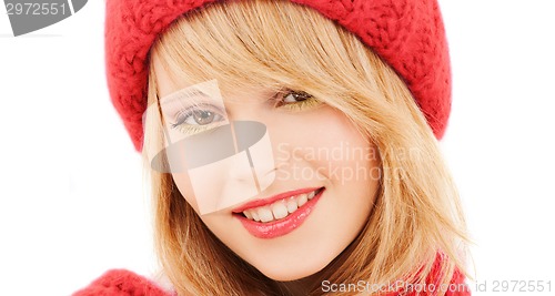 Image of close up of smiling young woman in winter clothes