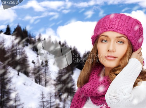 Image of smiling young woman in winter clothes