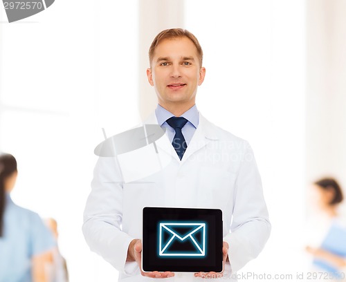 Image of smiling male doctor with tablet pc