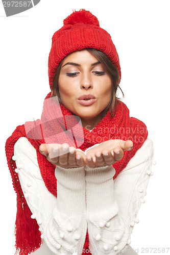 Image of Winter woman blowing at palms