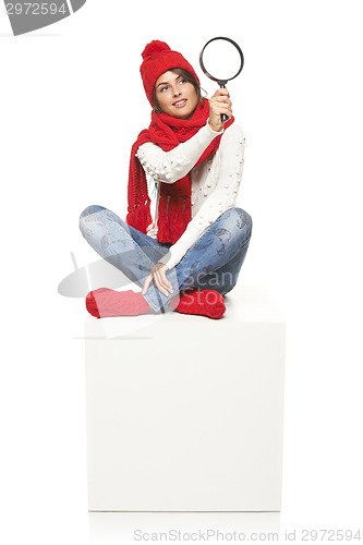 Image of Winter woman sitting on blank billboard placard sign