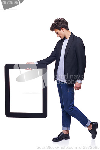 Image of Full length man holding empty frame